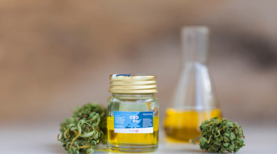 Medicinal CBD oil with leaves